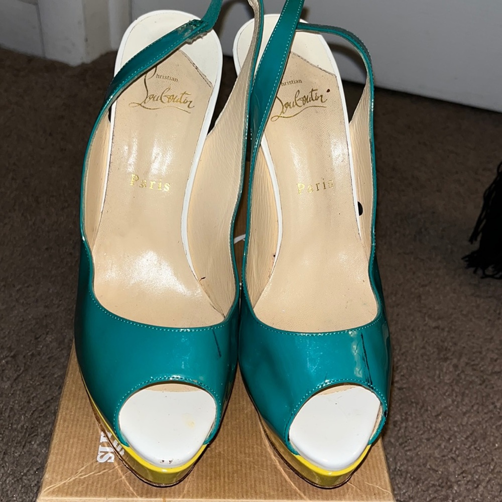 Christian Louboutin Used. Right back strap has been reattached due breaking.